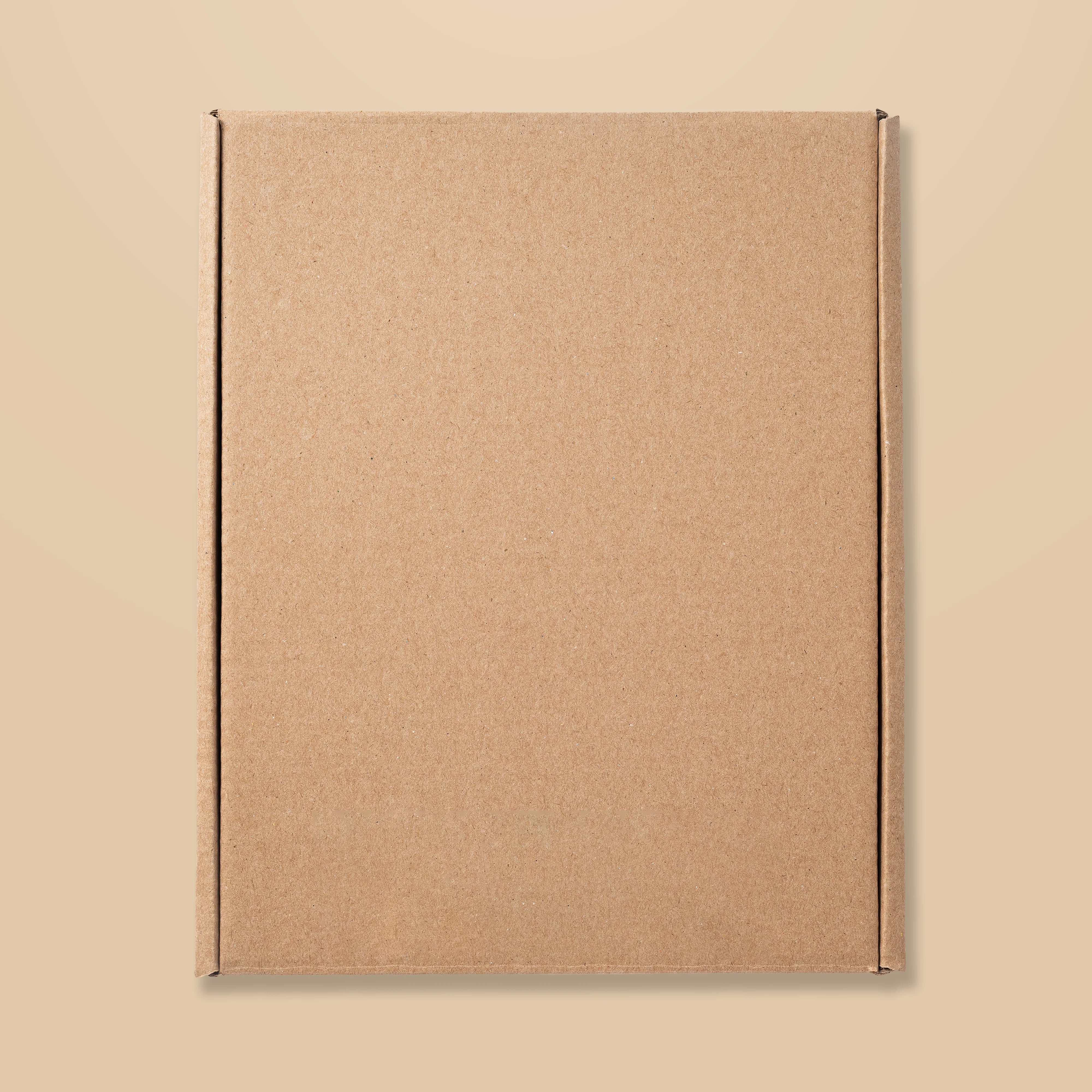 Cardboard box on a beige background