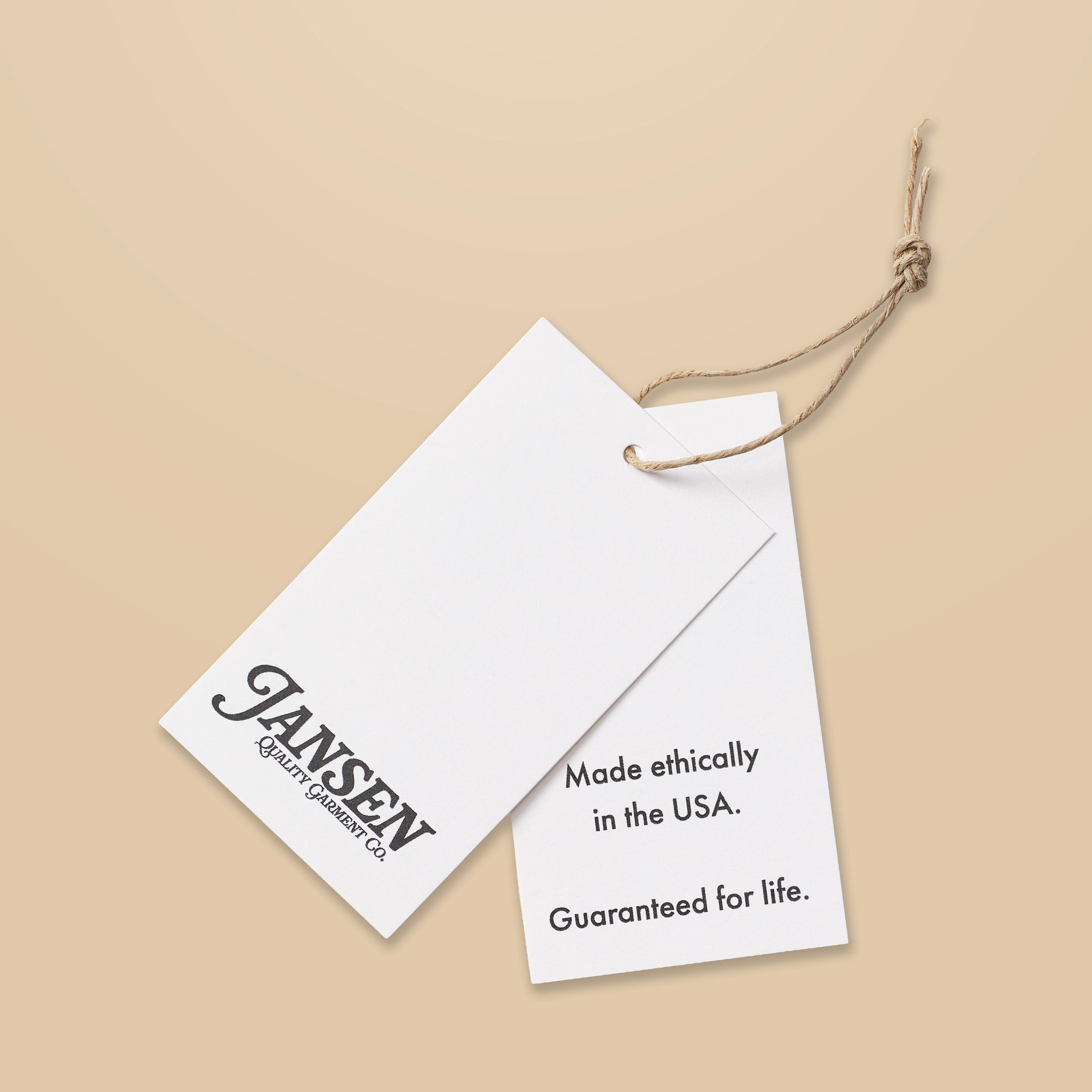 White tag with Jansen logo and text on a beige background